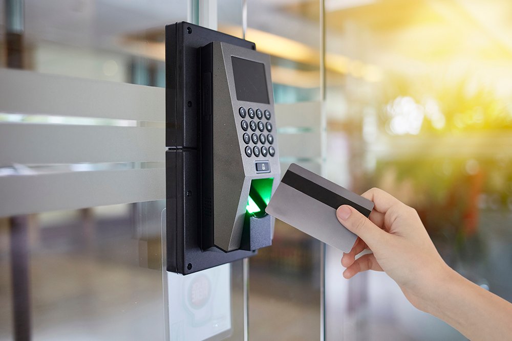 Young woman hold key card to access door office